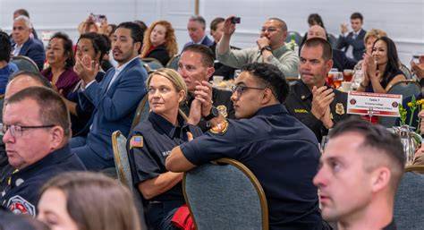 Photo of firefighters receiving awards during a ceremony