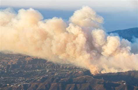 Thematic photo of wildfires in Los Angeles with smoke visible over the city skyline