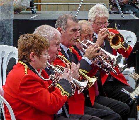 Thematic photo of a brass band performing in a local community setting