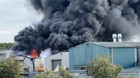 Thematic photo of Firehouse 51 firefighters responding to a large factory fire