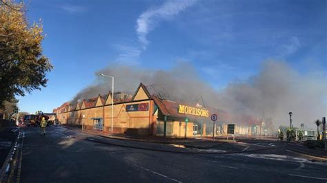 Thematic photo of a burning supermarket or fire brigade in action