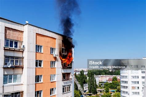 Photo of a residential building fire with smoke