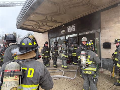 Photo of firefighters working at a commercial building fire