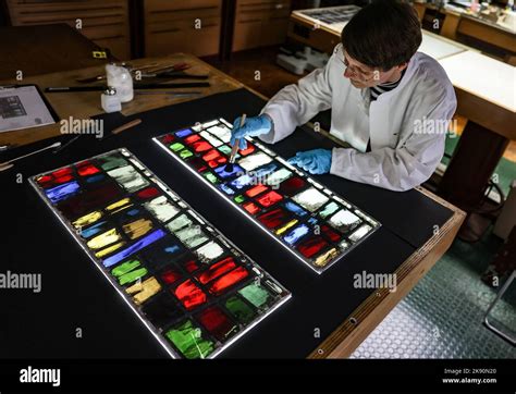 Photo of Katrin Wittstadt working on stained glass in Cologne workshop
