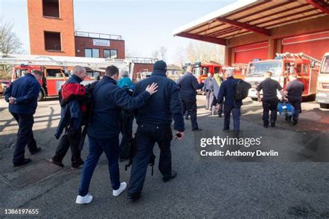 Photo of OSP members preparing to leave the fire station for an action