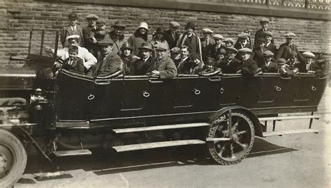 Historical photo of OSP Pułanki members with their early vehicles