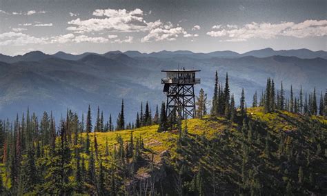 Photo of the interior of a basic fire lookout cabin with equipment
