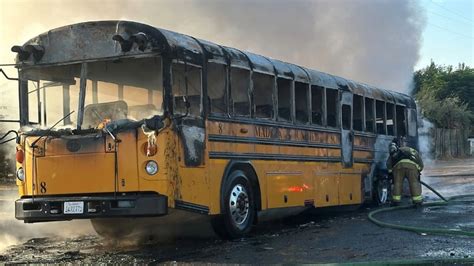 Thematic photo of a burning bus on a road