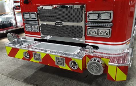 Thematic photo of the front of a fire truck with a bumper cannon and a winch