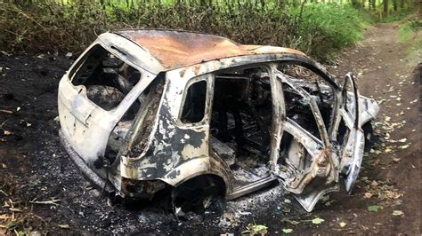 Photo of a completely burned-out car in Bieszczady.