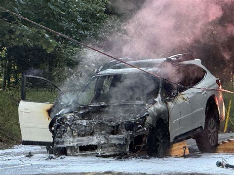 Photo of a car after hitting a pole and catching fire in Wrocław.