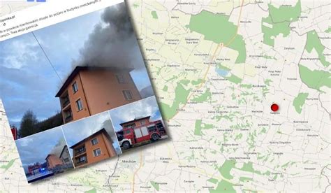 zdjęcie dymu unoszącego się nad płonącym budynkiem mieszkalnym