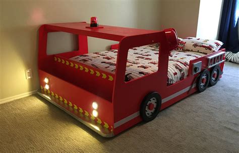 Detailed view of the NEW FIRE TRUCK bed showing chromowane koła and low entrance