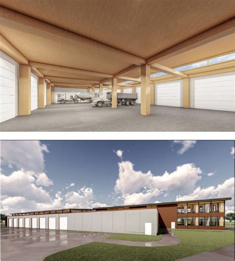 Photo of a large industrial hall interior with vehicle bays