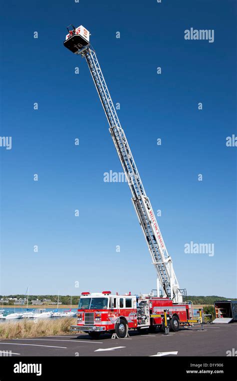 Photo of a fire truck with an extended hydraulic ladder