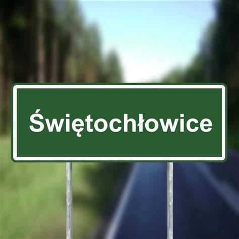 Znak drogowy Świętochłowice z radiowozem policyjnym w tle