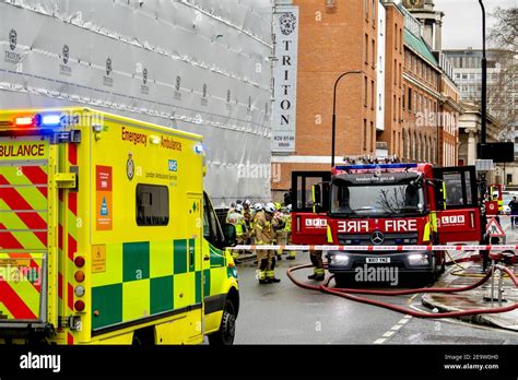Thematic photo of an escape room entrance or a fire incident scene with emergency vehicles