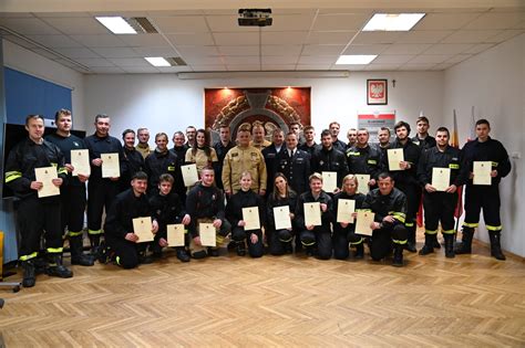 Photo of an award ceremony with OSP Brzesko members