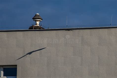 Thematic photo showing a fire alarm siren on a building roof